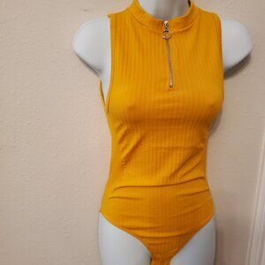 Women's Sleeveless Knit Bodysuit 1/4 Zip up front closure Fits True Size.